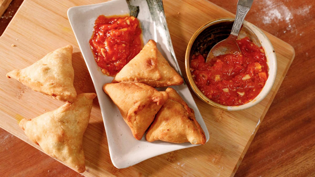 Samosas & Chutney. Asma teaches how to make India's favorite street food, Bengali-style samosas (known as singara), that are stuffed with an aloo gobi filling of cauliflower, potatoes, peanuts, and seasonings like ginger and turmeric. She pairs it with a fiery tomato chutney.